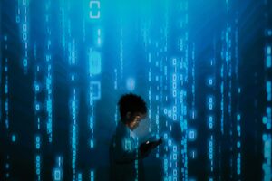 Child using tablet with binary code background