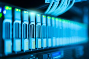 Close-up of illuminated server hardware in data center.