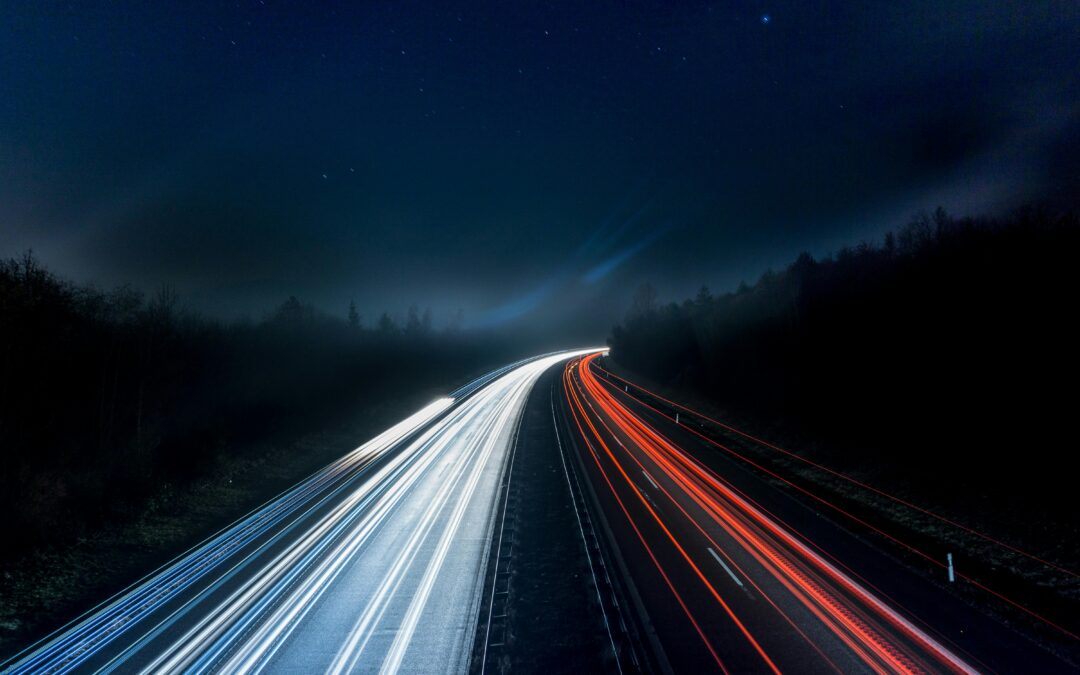 Night highway with car light trails