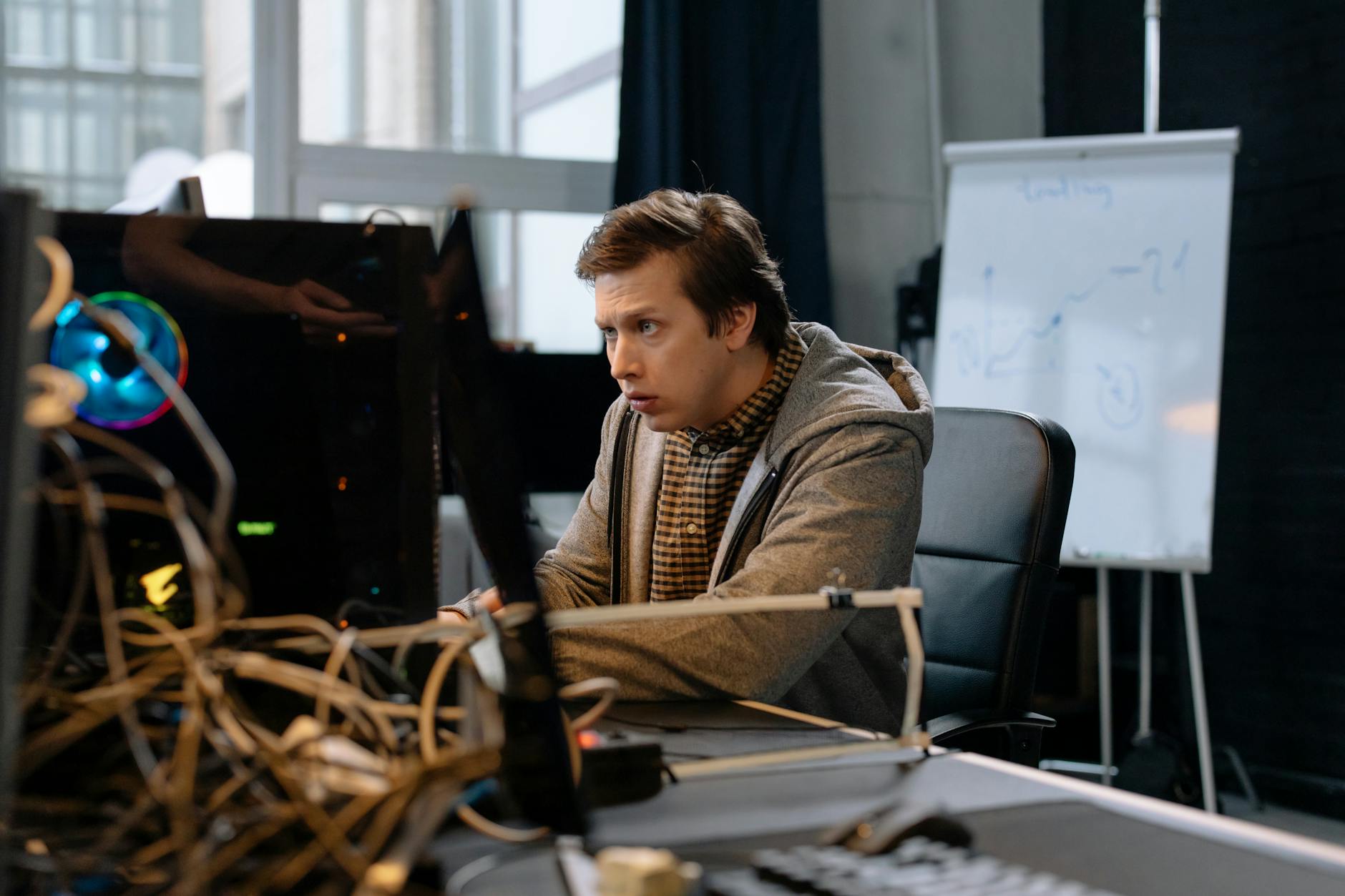 Product team aligning around KPIs on a large screen dashboard